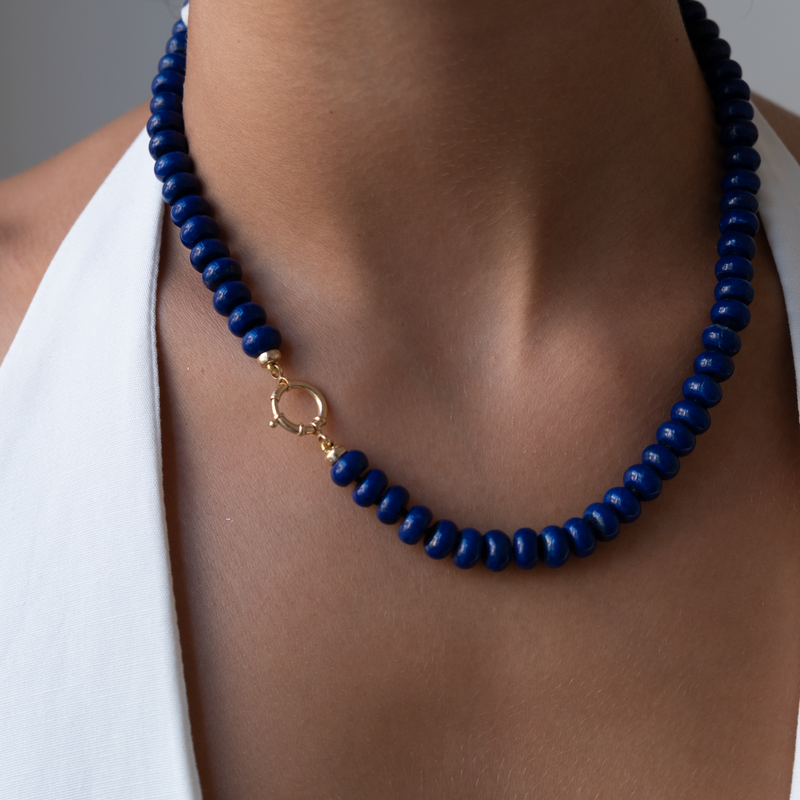 lapis lazuli gemstones in 8mm rondels are hand knotted on a silk cord